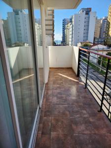a balcony with a view of the city at Miramar in Miramar