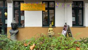 a building with a sign that reads zinc valleyanguard museumium at Surya Villa Holistic Stay Prenzlauer Berg in Berlin