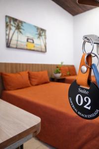 a hotel room with a bed with a sign on it at IMPERIAL BEACH ENSEADA 500 Metros Praia Enseada Gjá Av Professor João Batista Julião x Antonio Del Nero Enseadas jardim Virgínia Bairro Nobre in Guarujá