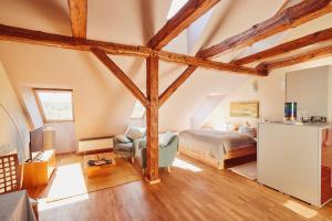 a bedroom with a bed and a chair in a room at Feriendomizil Alter Garten in Temmen-Ringenwalde +95 photos
