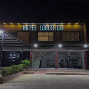 a hotel lobby with a hotel lobsterico sign at night at Hotel Logistico in Santa Marta