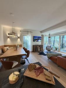 a living room with a table with food on it at WaldQuartier in Memmelsdorf