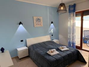 a bedroom with two towels on a bed at Deep Sea Residence in Agrigento +74 photos