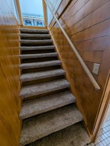 a set of stairs in a building at Studio Loft #9 at Riverside Point Resort in Park Rapids