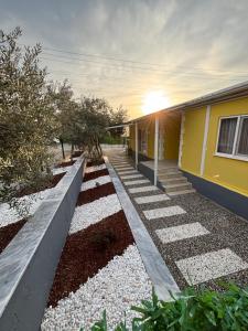 a house with a walkway next to a building at Çilek Home in Pamukkale