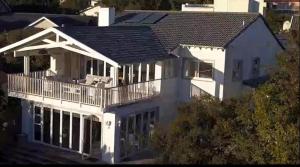 an aerial view of a white house with a deck at The Joneses in Plettenberg Bay +168 photos