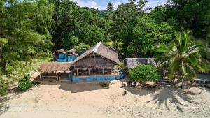 an aerial view of a house on the beach at Port Olry BBQ Table and Camping Side in Port-Olry