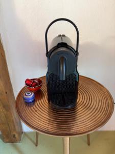 a tea pot sitting on top of a table at Atelies View House in Potamiá