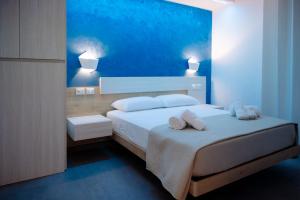 a bedroom with a bed with two towels on it at Orizzonte Blu in Villa San Giovanni +34 photos