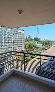 a balcony with a view of a street at Epindi Studio Apartment in Cox's Bazar
