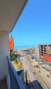 a view from a balcony of a city street at Epindi Studio Apartment in Cox's Bazar +6 photos