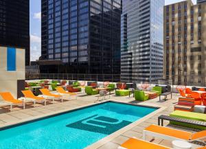 a pool on the roof of a building at Aloft by Marriott Houston Downtown in Houston