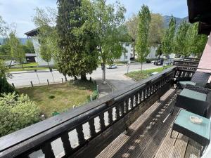 a balcony with benches and a view of a street at BOHO Apartment Skye in Bad Reichenhall