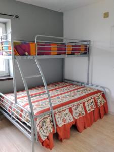 a bedroom with two bunk beds in a room at Gure Bidetxe in San Andrés