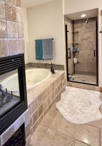 a large bathroom with a tub and a shower at Cozy Light Filled Truckee Downtown in Truckee