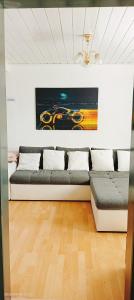 a room with two beds and a painting on the wall at Ferienhaus Medebach in Medebach