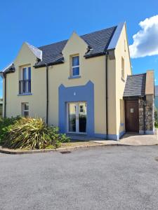 a detached house with a garage on a street at Doolin Court in Doolin