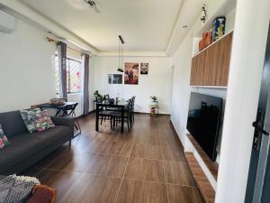 a living room with a couch and a table at F2 Farmhouse in Omuthiya