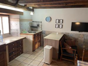 a kitchen with a sink and a counter top at Las Carminas in Soto