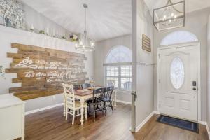 a dining room with a table and chairs at Relaxed Poolside Gym Escape in Green Cove Springs