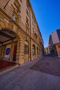 an empty street in front of a building at NS Urban Suite in Udine