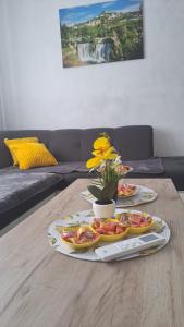 a table with two plates of food on top of it at Jelena in Jajce