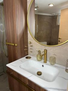 a bathroom with a sink and a mirror at Olivia -Ελιά in Paleo Tsifliki +110 photos
