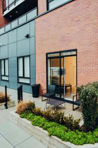 a glass building with a bench in front of it at Family Friendly Ground Level Condo in Surrey