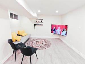 a white living room with a couch and chairs at New and Stylish 3BR Private Basement Apartment with 3 Baths & Parking in Richmond Hill