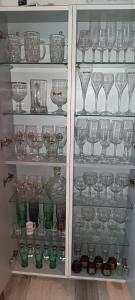 a cupboard filled with lots of glasses and dishes at Verrecheznous-lepuy in Le Puy-Notre-Dame +11 photos