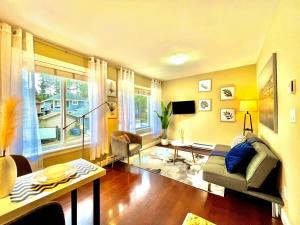 a living room with a couch and a table at The Royal Suite in Surrey +34 photos