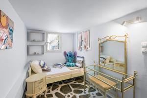 a small room with a bed and a mirror at Antigone's Blue Vista in Kampos Paros