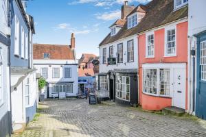 an alley in a town with colorful houses at 4 Bed in Lymington oc-c41423 in Lymington