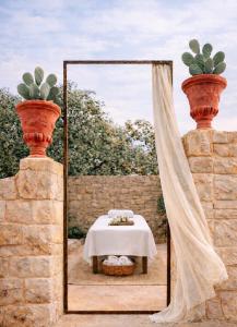 a table in front of a mirror with a white table at Boreas Retreat - Mountain Escape & Spa in Batroûn