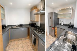 a kitchen with stainless steel appliances and a sink at Greenhithe Guest House in Stonewood