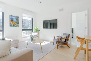 a living room with a couch and a table at Summit Central in Revelstoke +22 photos