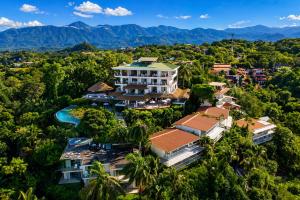 an aerial view of a resort in the jungle at Hotel La Mariposa in Manuel Antonio