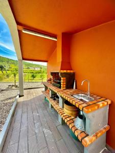 a kitchen with a sink and a counter at Quinta Santo Antonio in Gouveia