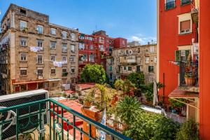 a view of a city from a balcony at Neve Al Sole Modern Suites near Metro Materdei in Naples Center in Naples