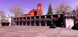 a hotel with a building with a clock tower at The Vine Hotel Bronx New in Bronx