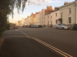 a street with cars parked on the side of the road at private room in Leamington Spa