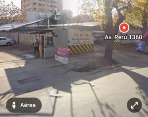 a view of a street with a sign on the sidewalk at Castelar in Mendoza