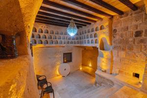 a room with a toilet in a stone building at Tyana Cave House in Nar +282 photos