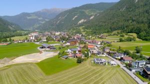 an aerial view of a small village in the mountains at Bungalow Laroo in Ried im Oberinntal