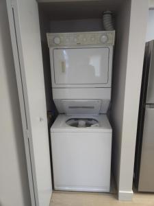 a washer and dryer in a small room at unique Two -Bedroom Central Townhouse in Vancouver