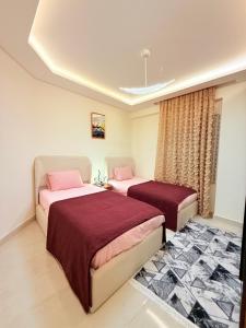 a bedroom with two beds in a room at Sharm Hills Elite Suite in Sharm El Sheikh +213 photos