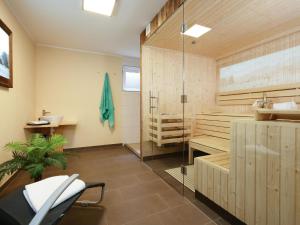 a bathroom with a shower and a toilet and a sink at Sonnen Lodge Kaprun in Piesendorf +23 photos