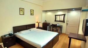 Ein Bett oder Betten in einem Zimmer der Unterkunft New Delhi YMCA Tourist Hostel