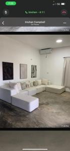 a living room with white couches in a room at Purevibe Horizon House Ocean View Villa Port Antonio in Port Antonio +35 photos