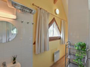 a bathroom with a sink and a window at Lac Bleu nr 10 in Lacapelle-Marival +36 photos